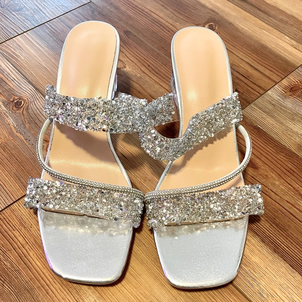 Size 9. Dress shoes. New. Never worn. Silver